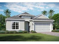Charming single-story home featuring a well-manicured lawn, a two-car garage and lush tropical landscaping at 2120 Antilles Club Dr # 10, Kissimmee, FL 34747