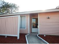 Charming home entrance with a welcoming pathway and well-maintained exterior at 2808 Waxy Willow Ln # 2808, Orlando, FL 32808
