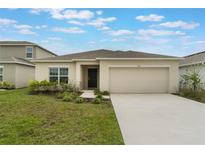 Charming single-Gathering home with a two-car garage and well-maintained front lawn at 3969 Southern Vista Loop, St Cloud, FL 34772