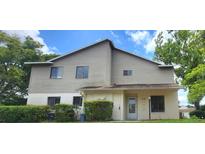 Charming two-story home with neutral siding and well-maintained landscaping in a suburban setting at 658 Olympic Dr, Ocoee, FL 34761