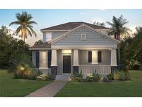 Charming two-story home featuring a welcoming front porch, well-manicured lawn, and tropical landscaping with palm trees at 18058 Cider Mill Ln, Winter Garden, FL 34787