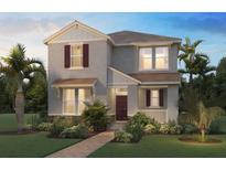 Charming two-story home boasts lush landscaping, a brick walkway, and a welcoming front porch with dark shutters at 18076 Cider Mill Ln, Winter Garden, FL 34787