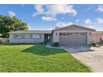 Charming single story home with brick exterior and well-maintained front yard at 1905 Diamond Dr, Orlando, FL 32807