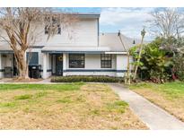Charming two-story home with landscaped front yard and inviting entrance at 2635 Graduate Ct, Orlando, FL 32826