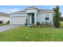 Charming single-Gathering home featuring a well-manicured lawn, attached two-car garage, and pleasant curb appeal at 663 Fairview Ave, Haines City, FL 33844