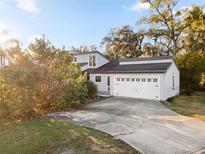 Charming two-story home with a well-maintained lawn and a convenient two-car garage at 910 Florida Blvd, Altamonte Springs, FL 32701