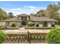 Stunning home with a tile roof, mature landscaping, and a welcoming entrance at 470 Manor Rd, Maitland, FL 32751