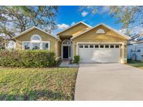 Charming single Gathering home featuring an attached garage and a well manicured lawn in a desirable neighborhood at 3001 Bellingham Dr, Orlando, FL 32825