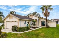 Charming single-story home with well-maintained landscaping and inviting curb appeal at 11320 Pink Blossom Ct, Orlando, FL 32821