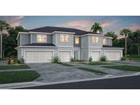 Inviting townhomes with modern curb appeal, featuring attached garages and well manicured landscaping at 3199 Emerald Acres Ln, Sanford, FL 32771