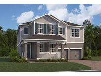 Two-story home showcases traditional architecture, gray siding, shutters, covered front porch, and a one-car garage at 17505 Glossy Pomelo Way, Winter Garden, FL 34787