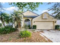 Charming single-story home with a well-manicured lawn and a two-car garage at 10809 Oak Glen Cir, Orlando, FL 32817