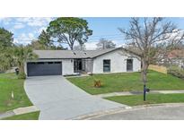 Charming single-story home with a well-maintained lawn and updated exterior at 7531 Lodge Pole Trl, Winter Park, FL 32792