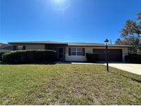 Charming single-story home featuring a well-maintained lawn and inviting curb appeal at 759 Swallow St, Deltona, FL 32725