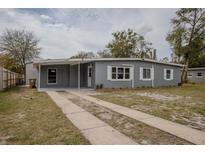Charming single-story home with a covered front porch and long driveway at 1285 Oak Dr, Mount Dora, FL 32757