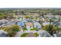 Neighborhood aerial view showcasing the community layout, streets, and nearby amenities at 458 Hollinghead Loop, Davenport, FL 33896