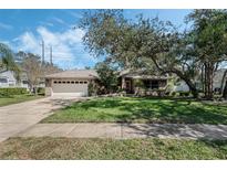Charming single Gathering home with well-manicured lawn and mature landscaping at 243 Shady Oaks Cir, Lake Mary, FL 32746