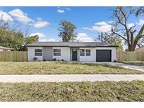 Charming single-story home with a freshly painted exterior and well-manicured lawn at 4536 San Sebastian Cir, Orlando, FL 32808