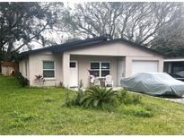 Charming single-story home with cozy outdoor seating and an attached garage at 1218 Depugh St, Altamonte Springs, FL 32701