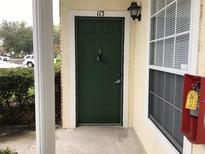 Close-up of the front door, showing a small porch and the unit number at 145 Reserve Cir # 113, Oviedo, FL 32765