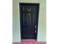 View of the front door, painted black with a door knocker and the letter B above it at 2025 Dixie Belle Dr # 2025 B, Orlando, FL 32812