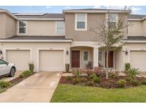 Charming townhome featuring a well-manicured lawn and welcoming front porch at 2029 Crystal Bell St, Orlando, FL 32824