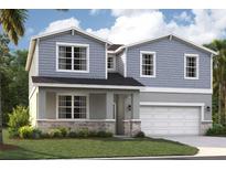 Charming two-story home featuring stone accents, shaker siding, a covered entry, and an attached two-car garage at 1136 Clay Blvd, Tavares, FL 32778