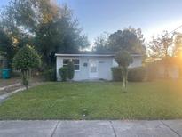 Charming single-story home with a simple yard and mature trees at 1805 Riley Ave, Orlando, FL 32805