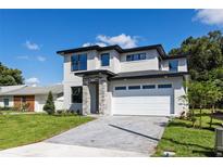 Striking two-story home with a stone accent entrance and a spacious two car garage at 1809 Simonton Ave, Orlando, FL 32806