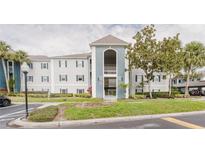 Condominium exterior featuring a blue and white color scheme and well-maintained landscaping at 1109 Clubside Dr # 1109, Longwood, FL 32779