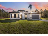 Charming single-Gathering home boasts a well-manicured lawn and attached two car garage at 15163 Sw 29Th Terrace Rd, Ocala, FL 34473