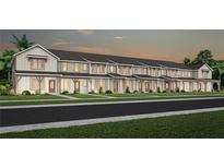 New construction townhomes featuring craftsman-style architecture, covered entries, and lush landscaping at 6424 Tabebuia Pkwy, Winter Garden, FL 34787