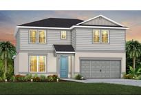 Charming two-story home with blue front door, two-car garage, landscaped yard, and neutral color palette at 2030 Branched Oak Rd, St Cloud, FL 34771