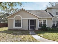 Inviting single story home with neutral color and screened front door at 2190 Cypress Bay Blvd, Kissimmee, FL 34743
