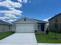 Charming single-story home with a well-manicured lawn and a classic two-car garage at 3641 Marlberry Way, Sanford, FL 32773