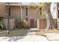 Inviting home exterior with a quaint front walkway and lush flowering bushes at 4828 Pebble Beach Dr # A, Orlando, FL 32811
