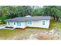 Charming single-story home featuring a newer roof, updated windows and a freshly painted exterior at 5390 E Hinson Ave, Haines City, FL 33844