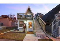 Charming A-frame cottage with a cozy balcony, wooden stairs and a unique 