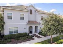 Inviting exterior view of home with a well-manicured front lawn and lush, green landscaping at 4967 Windermere Ave, Kissimmee, FL 34746