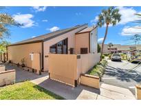 Charming condo with desert landscaping, lovely sky, and well-maintained exterior at 2447 Ne 7Th St, Ocala, FL 34470