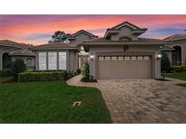 Charming home featuring a manicured lawn and a two-car garage, perfect for suburban living at 501 Sotheby Way, Debary, FL 32713