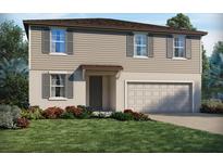 Two-story home featuring a neutral color palette, attached garage, and a well-manicured front yard at 2311 White Tail St, Davenport, FL 33837