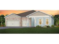 Charming single-Gathering home featuring stone accents, a two-car garage, and fresh landscaping at 1593 Evening Summit Cir, Minneola, FL 34715