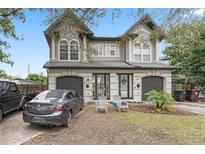 Charming townhouse with a well-manicured lawn and two-car garage at 3007 E Central Blvd # 3007, Orlando, FL 32803