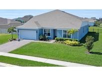 Charming single-story home with lush green lawn and neatly manicured landscaping at 4210 Sunset Preserve Blvd, Orlando, FL 32820
