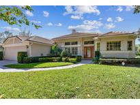Charming one-story home with lush green lawn and meticulously landscaped front yard at 442 Devon Pl, Lake Mary, FL 32746