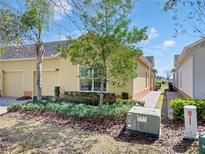 Charming home exterior features a well-maintained lawn and two-car garage at 3640 Solana Cir # A, Clermont, FL 34711