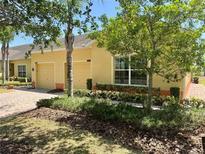 Charming single-story home featuring a well-manicured front lawn and an attached two-car garage at 3640 Solana Cir # A, Clermont, FL 34711