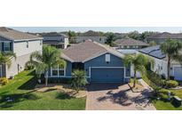 Charming single-story home featuring a well-manicured lawn and a brick driveway at 3861 Hanworth Loop, Sanford, FL 32773