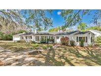 Charming single-story home with manicured lawn and a traditional style that exudes warmth and curb appeal at 321 E Copeland Dr, Orlando, FL 32806